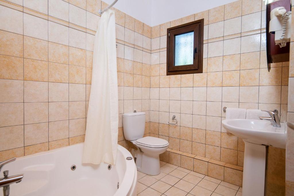 A bathroom at Olive Tree Villas