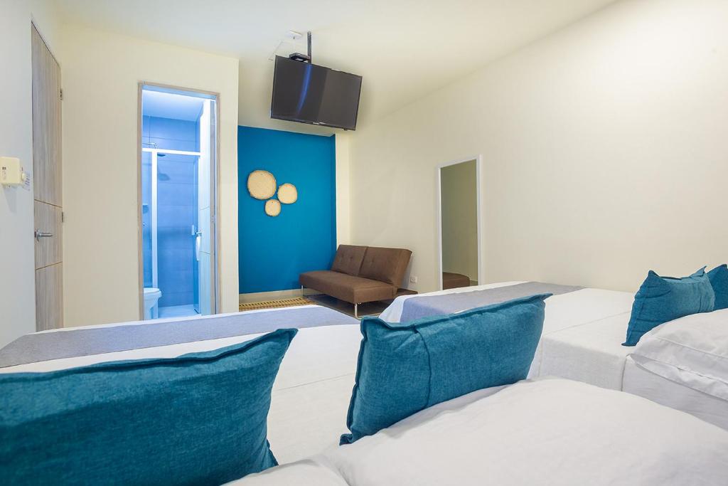 Postel nebo postele na pokoji v ubytování Ayenda Hotel Alejandría