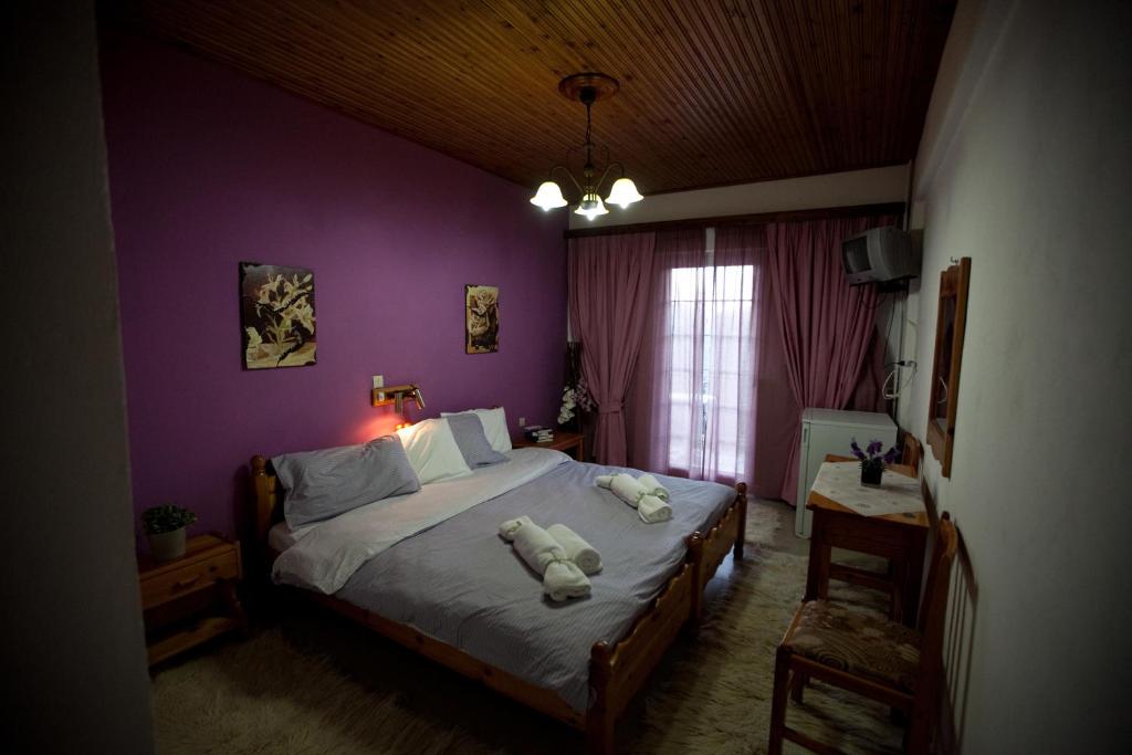 Postel nebo postele na pokoji v ubytování Χenonas Ziakos