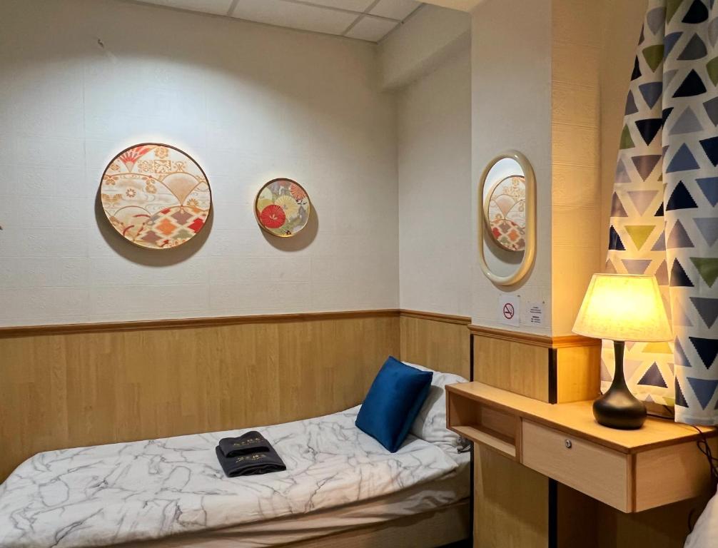 Postel nebo postele na pokoji v ubytování 利園賓館