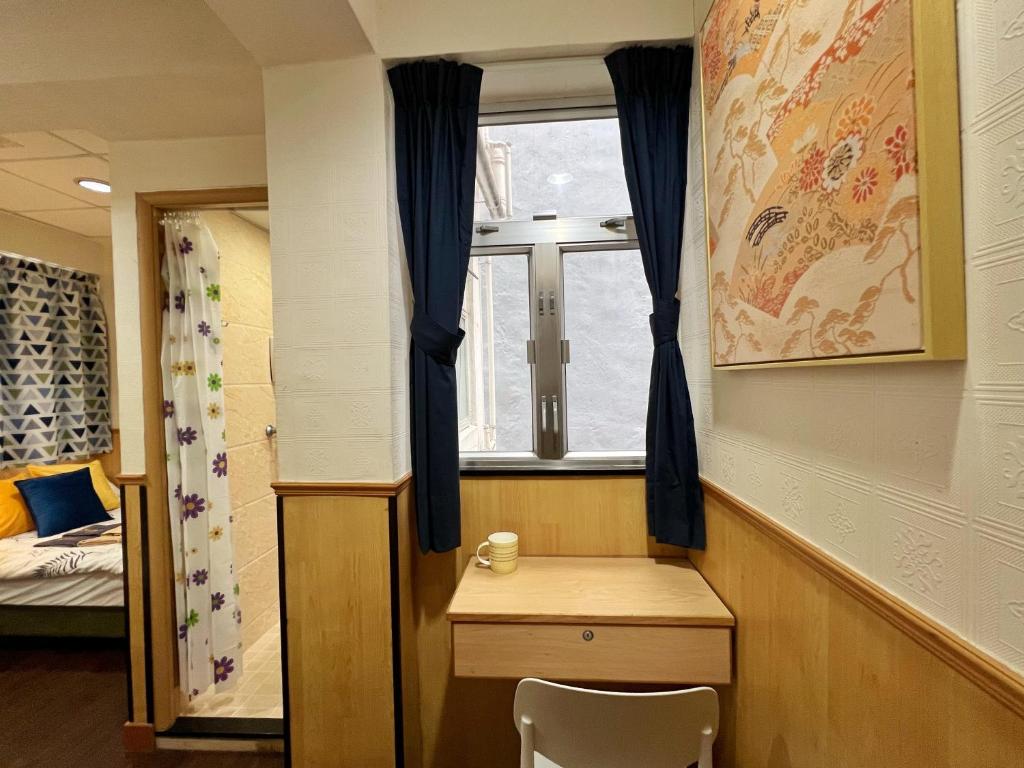Postel nebo postele na pokoji v ubytování 利園賓館