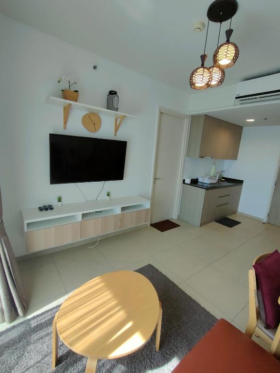 TV a/nebo společenská místnost v ubytování unixx seaview