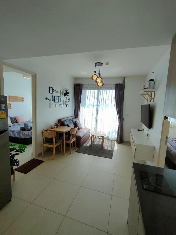 TV a/nebo společenská místnost v ubytování unixx seaview