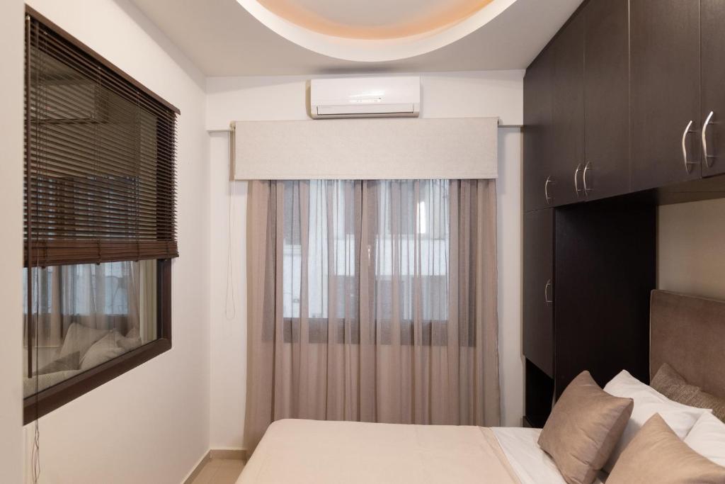 Postel nebo postele na pokoji v ubytování Pasiphae Lux Apartment Downtown