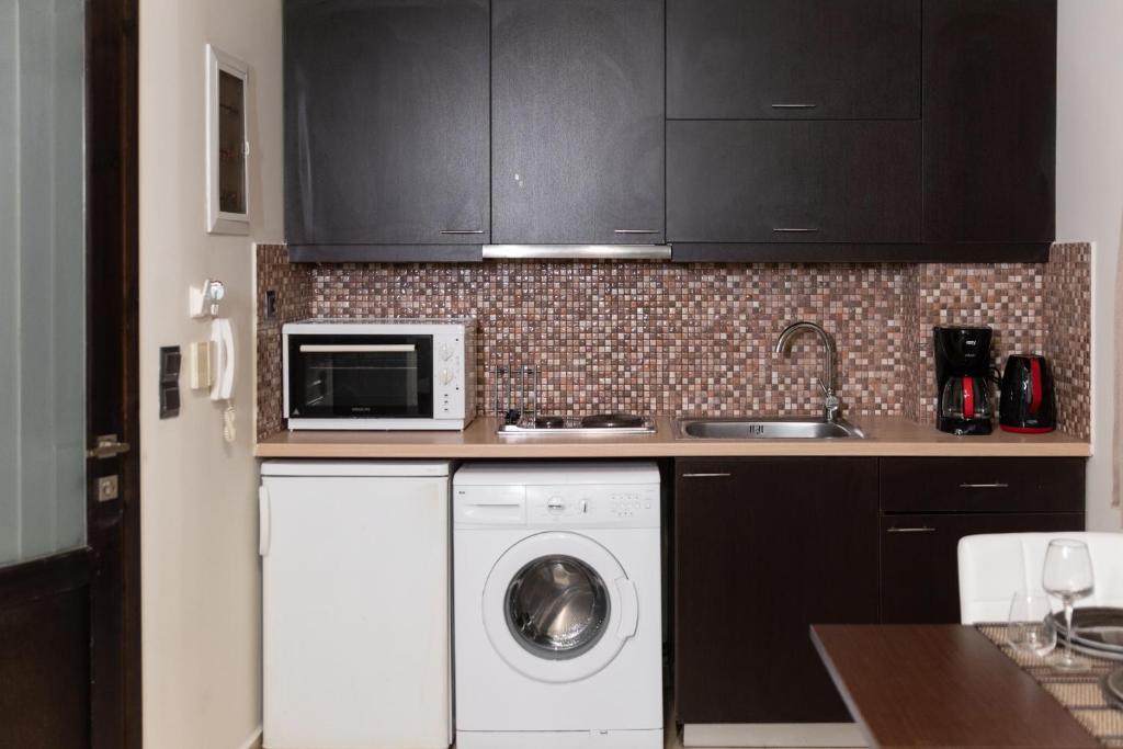 Kuchyň nebo kuchyňský kout v ubytování Pasiphae Lux Apartment Downtown