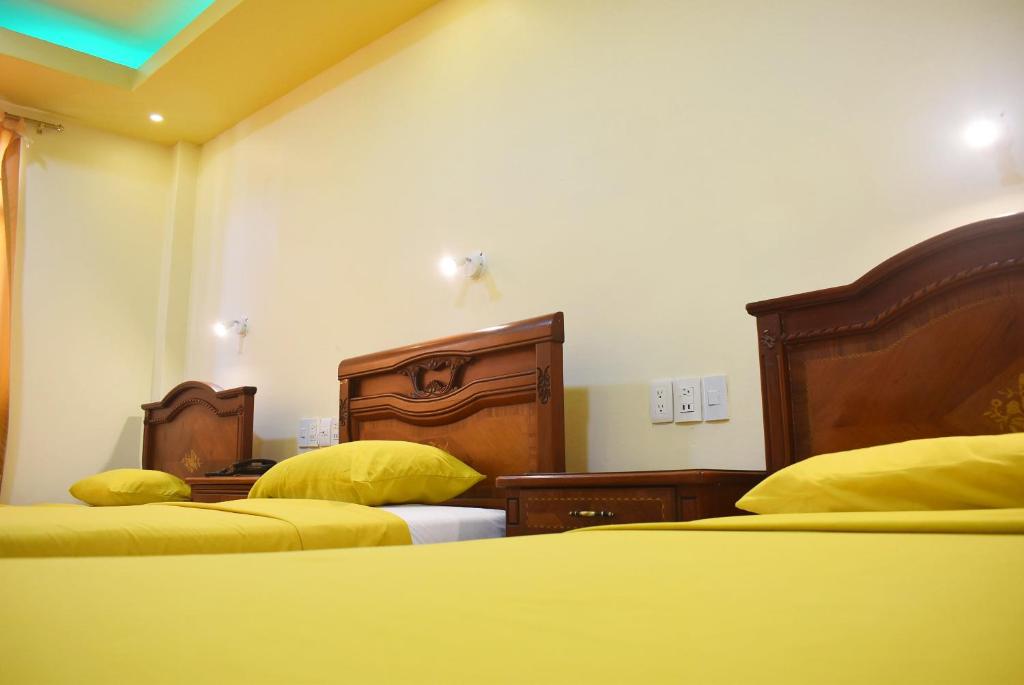 Postel nebo postele na pokoji v ubytování Hostal Galápagos - Guayaquil