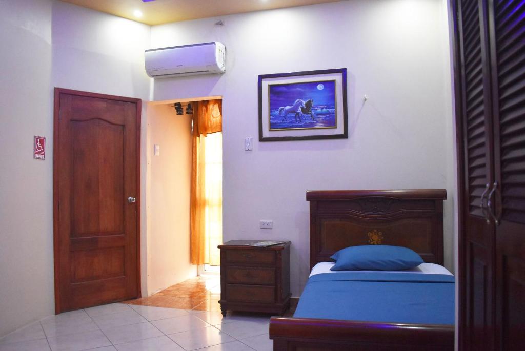 Postel nebo postele na pokoji v ubytování Hostal Galápagos - Guayaquil