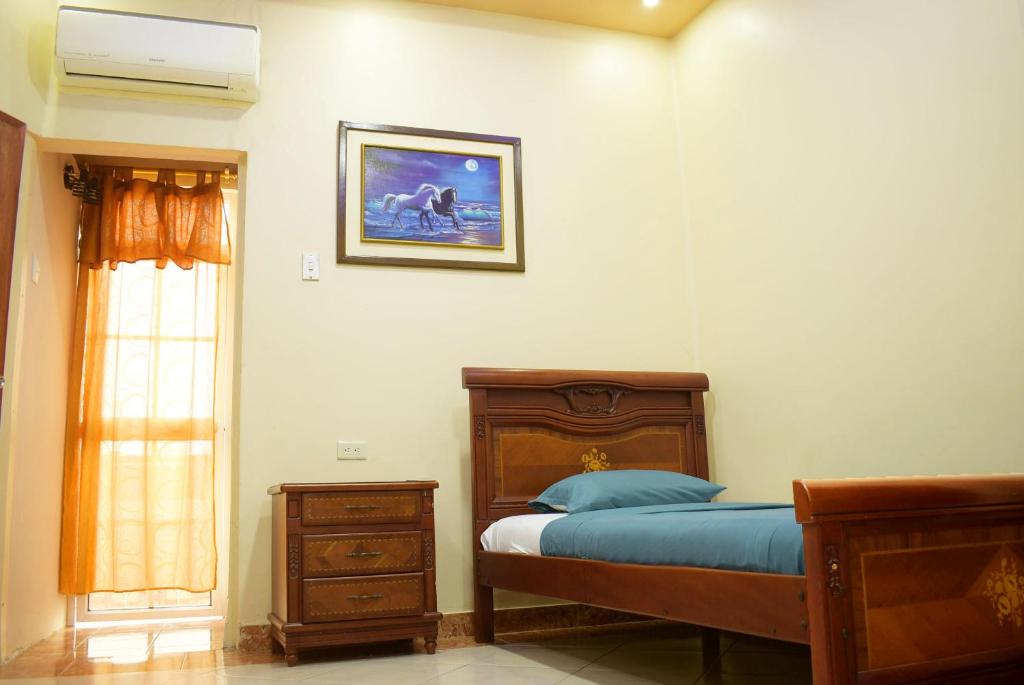 Postel nebo postele na pokoji v ubytování Hostal Galápagos - Guayaquil