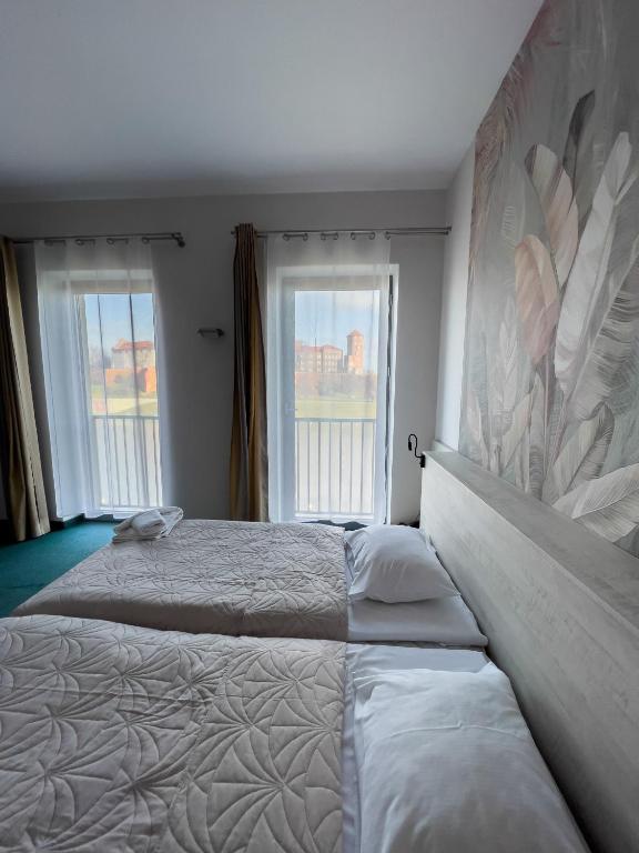 Postel nebo postele na pokoji v ubytování Hotel Poleski