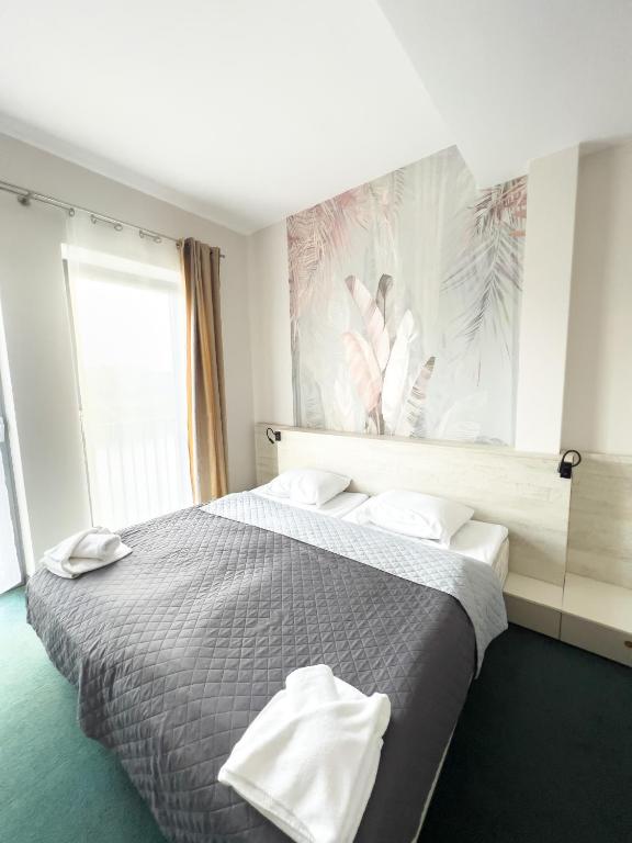 Postel nebo postele na pokoji v ubytování Hotel Poleski