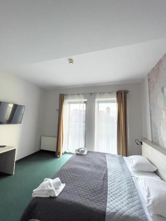 Postel nebo postele na pokoji v ubytování Hotel Poleski