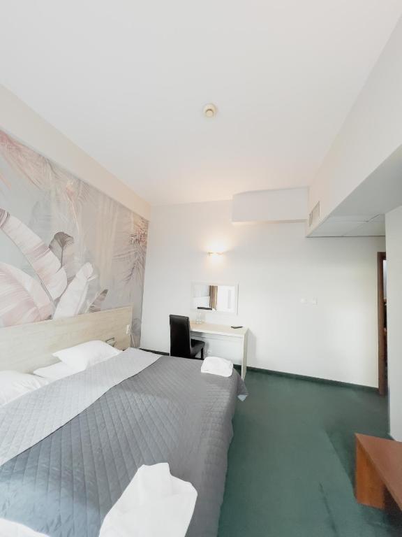 Postel nebo postele na pokoji v ubytování Hotel Poleski