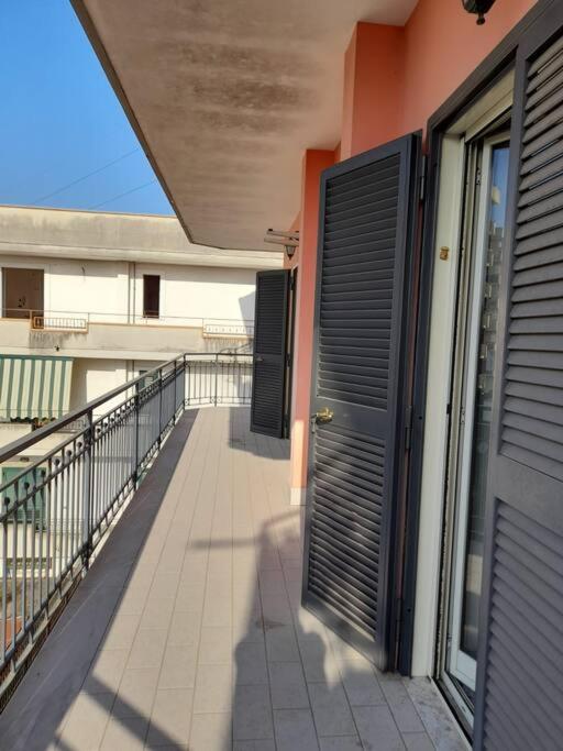 a balcony of a building with a door on it at Appartamento con parcheggio gratuito all'interno in Casalnuovo di Napoli