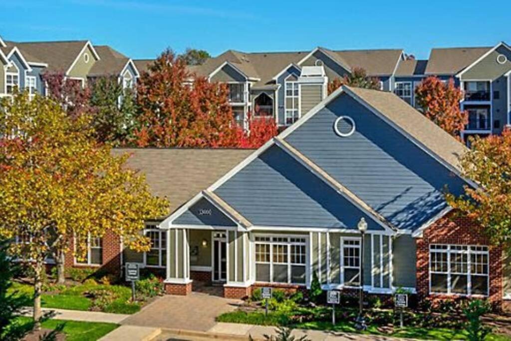 a house with a blue roof at Garden Styles Herndon Dulles Airport in Herndon