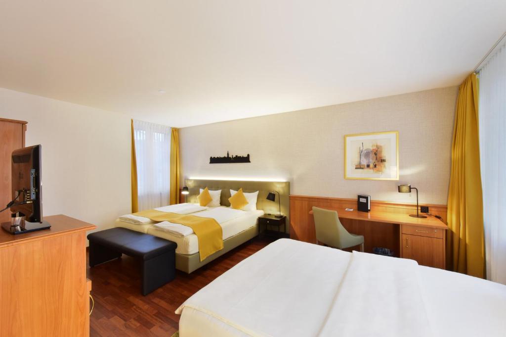 Postel nebo postele na pokoji v ubytování Hotel Engel