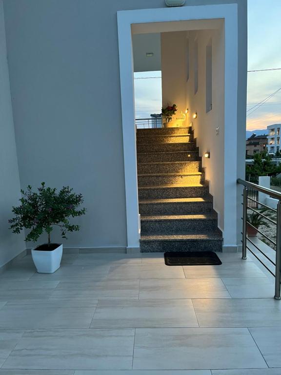 a set of stairs on a house with a plant at Villa Angelina Ksamil in Ksamil