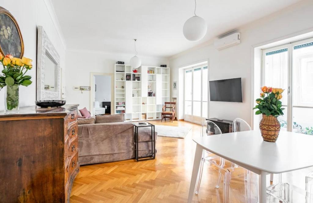 a living room with a couch and a table at Cicerone Apartment in Rome