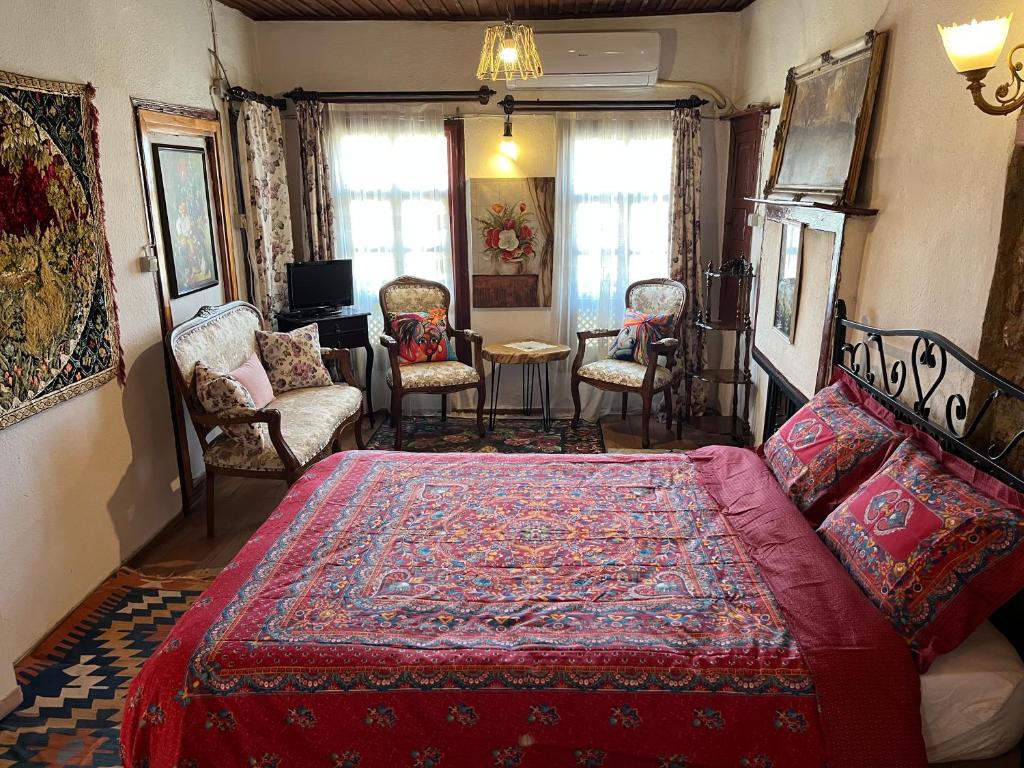 A bed or beds in a room at Mystic Konak