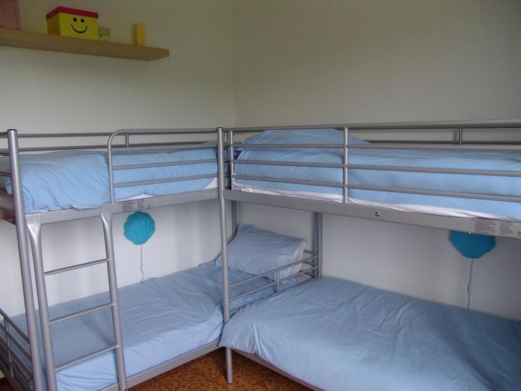 A bed or beds in a room at Casa Roberto Pool with Bar 5 bedrooms 2 bathrooms Great For Groups