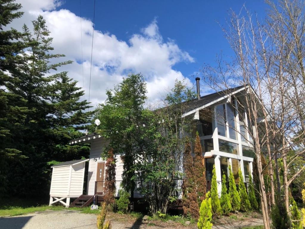 a brick house with trees in front of it at Polar House Karuisawa - Vacation STAY 30319v in Kutsukake