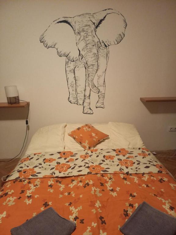 Posteľ alebo postele v izbe v ubytovaní Elefántos Apartman