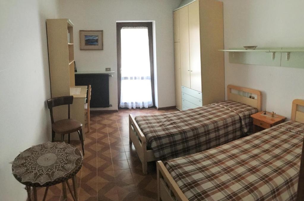 Postel nebo postele na pokoji v ubytování Appartamento Cogolo con terrazza 7 posti