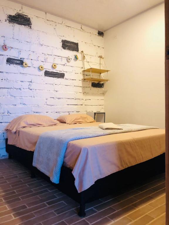 Postel nebo postele na pokoji v ubytování Casa Egos Pop Laureles