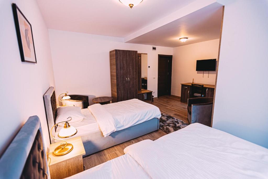 Postel nebo postele na pokoji v ubytování Motel Piatra Corbului