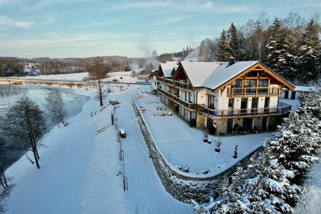 an aerial view of a lodge in the snow at Rezidence KUPEC in Frymburk