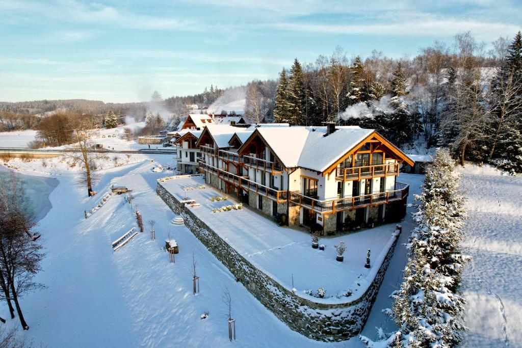 an aerial view of a house in the snow at Rezidence KUPEC in Frymburk