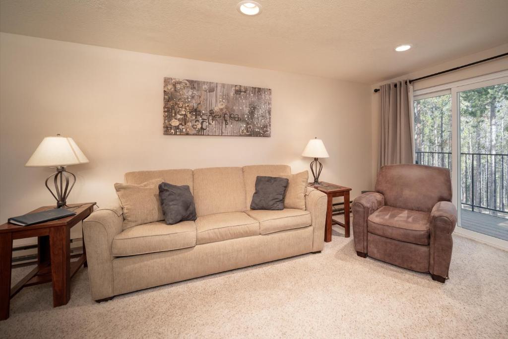 a living room with a couch and a chair at Beaver Village Unit #1624 in Winter Park
