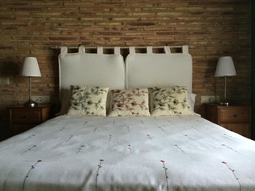 Postel nebo postele na pokoji v ubytování Hotel El Convent 1613