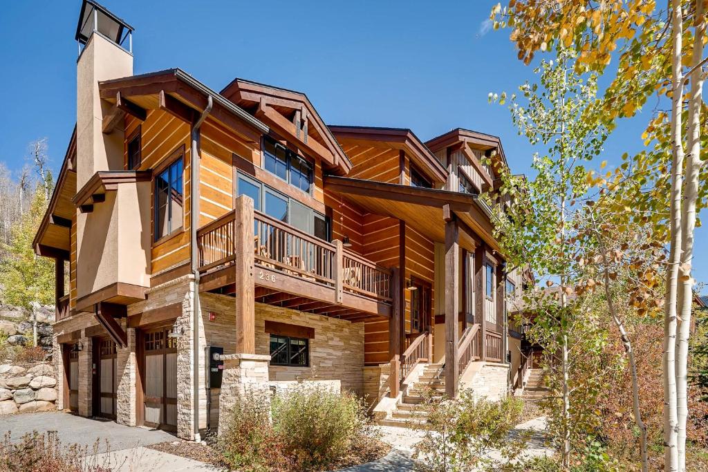 a log home with a balcony and stairs to it at Keystone Private Homes by Keystone Resort in Keystone