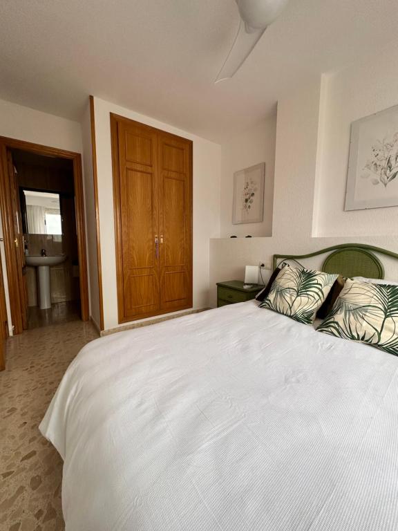 Postel nebo postele na pokoji v ubytování Precioso apartamento con piscina