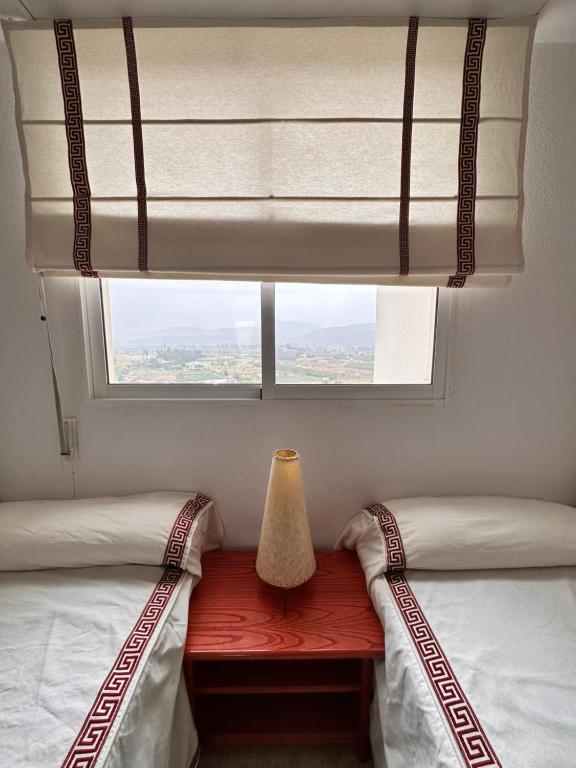 Posezení v ubytování Precioso apartamento con piscina