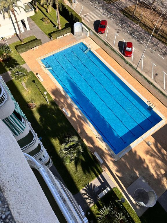 Bazén v ubytování Precioso apartamento con piscina nebo v jeho okolí