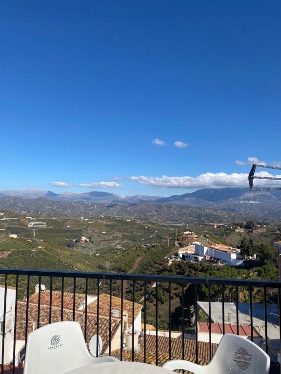 a view of the mountains from the balcony of a house at Casa Nora in Iznate