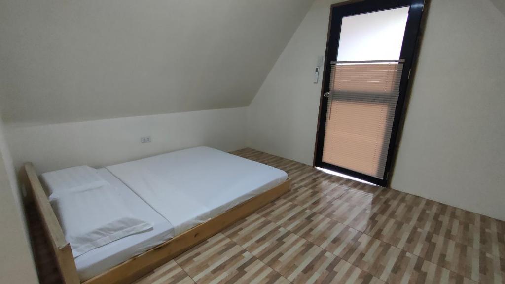 Postel nebo postele na pokoji v ubytování Dwarf Guest House