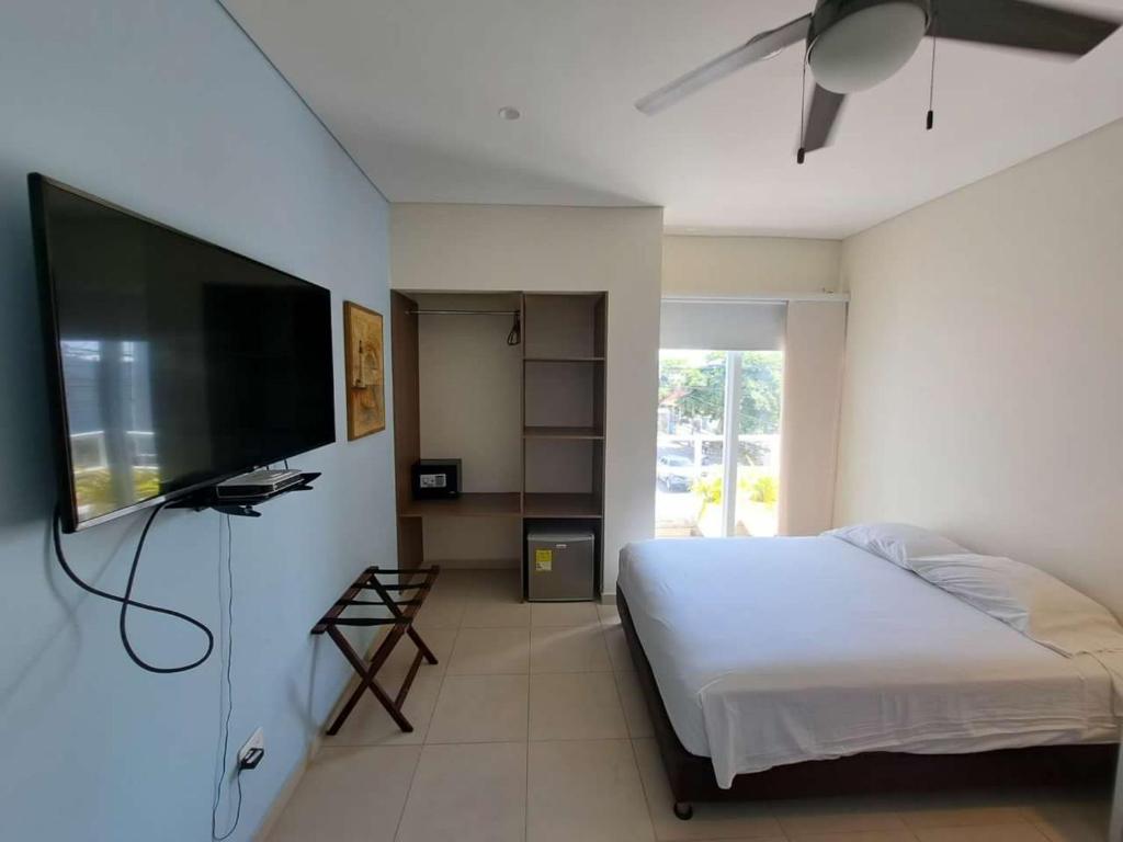 TV o dispositivi per l'intrattenimento presso Summer House Inn San Andres