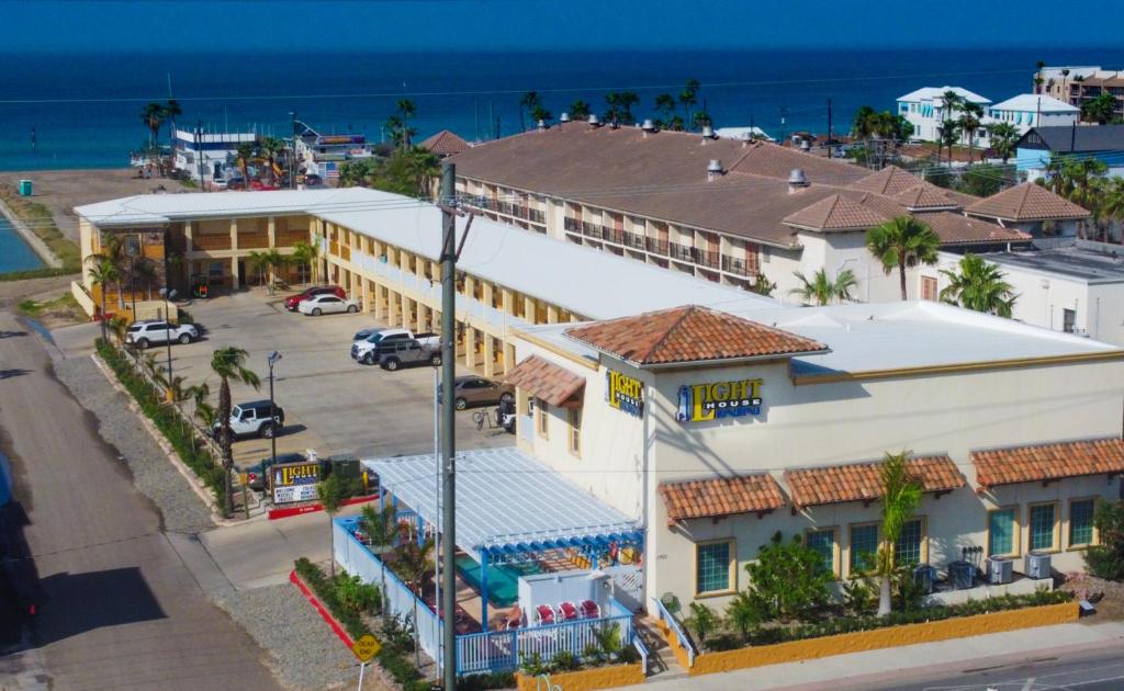 an aerial view of a building with the ocean in the background at Lighthouse Inn in South Padre Island