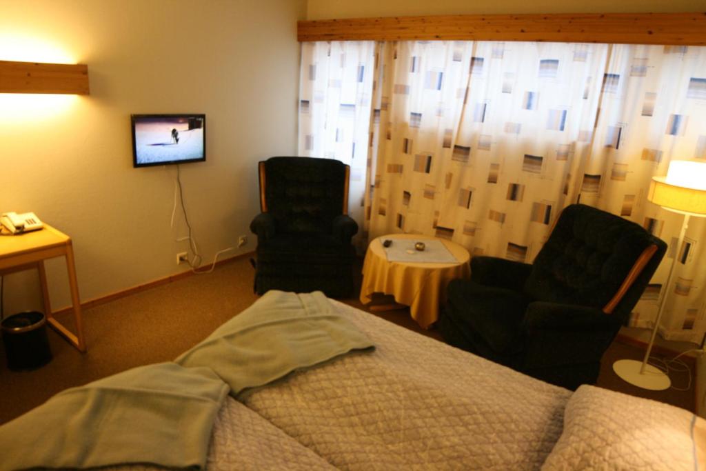 TV a/nebo společenská místnost v ubytování Overhalla Hotel