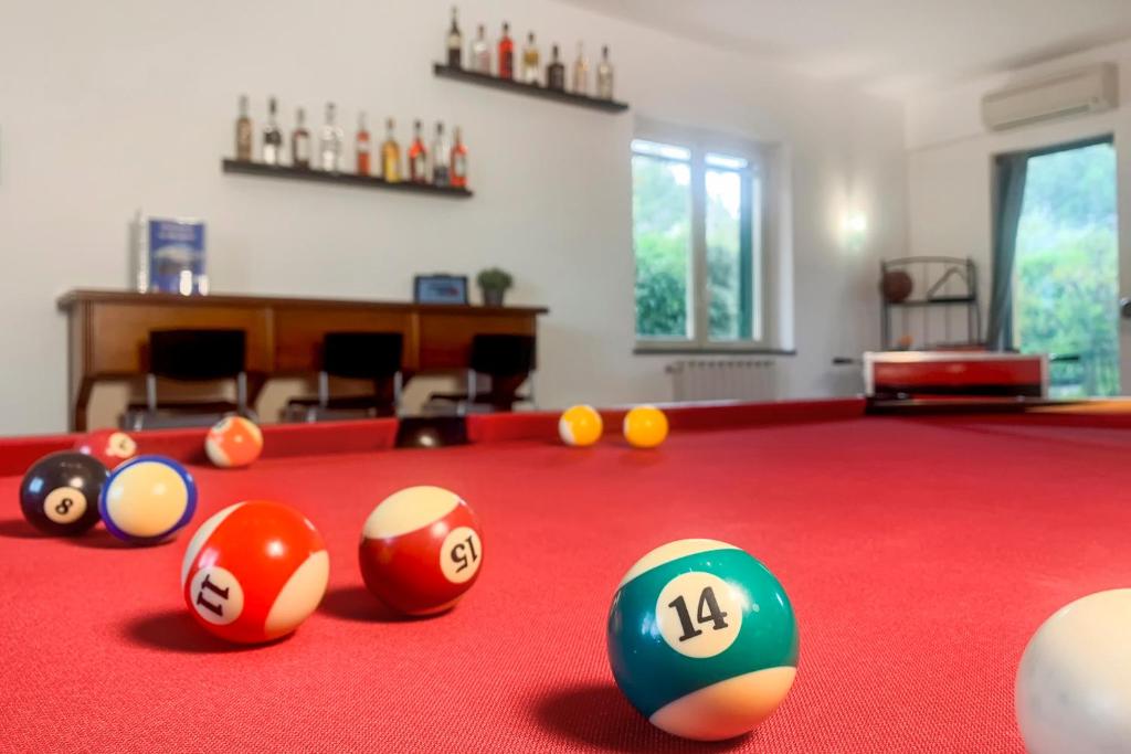 a billiard room with balls on a pool table at PrimeStay in Nicolosi