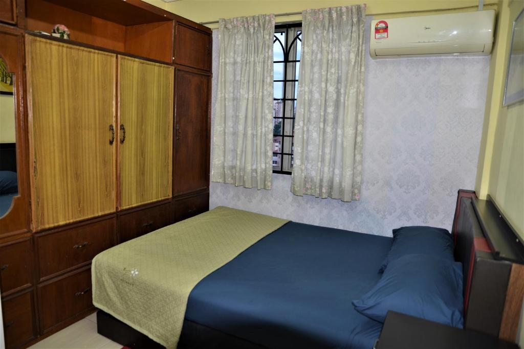 Postel nebo postele na pokoji v ubytování Awedee Homestay Putrajaya