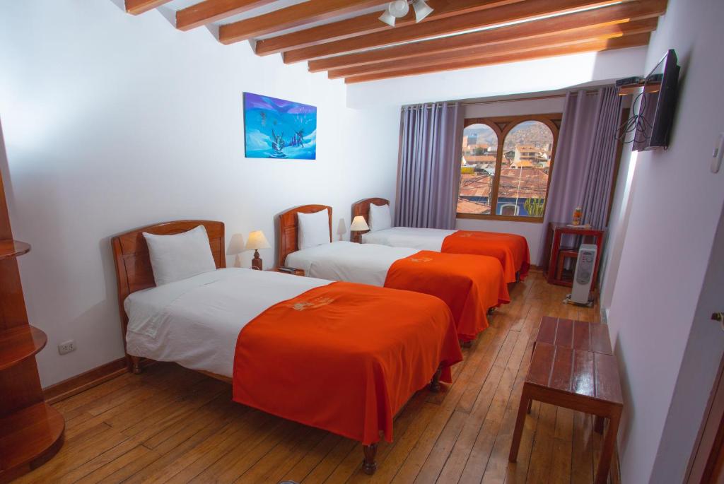 Letto o letti in una camera di Centenario Inn