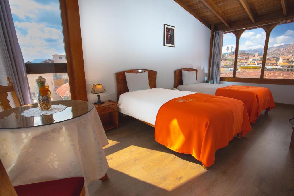 Letto o letti in una camera di Centenario Inn