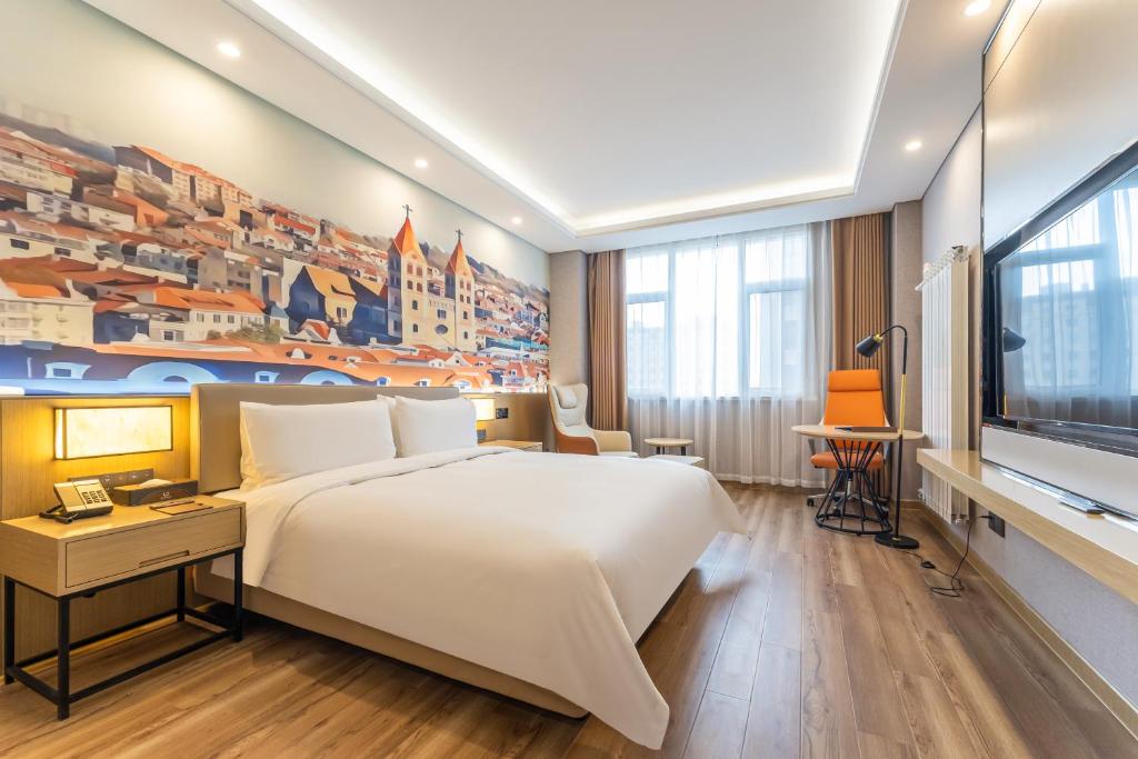 Postel nebo postele na pokoji v ubytování Joy Fall Hotel