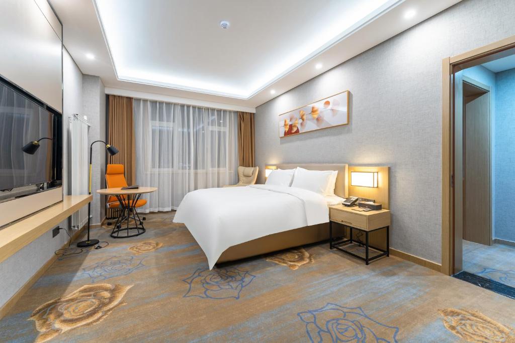 Postel nebo postele na pokoji v ubytování Joy Fall Hotel