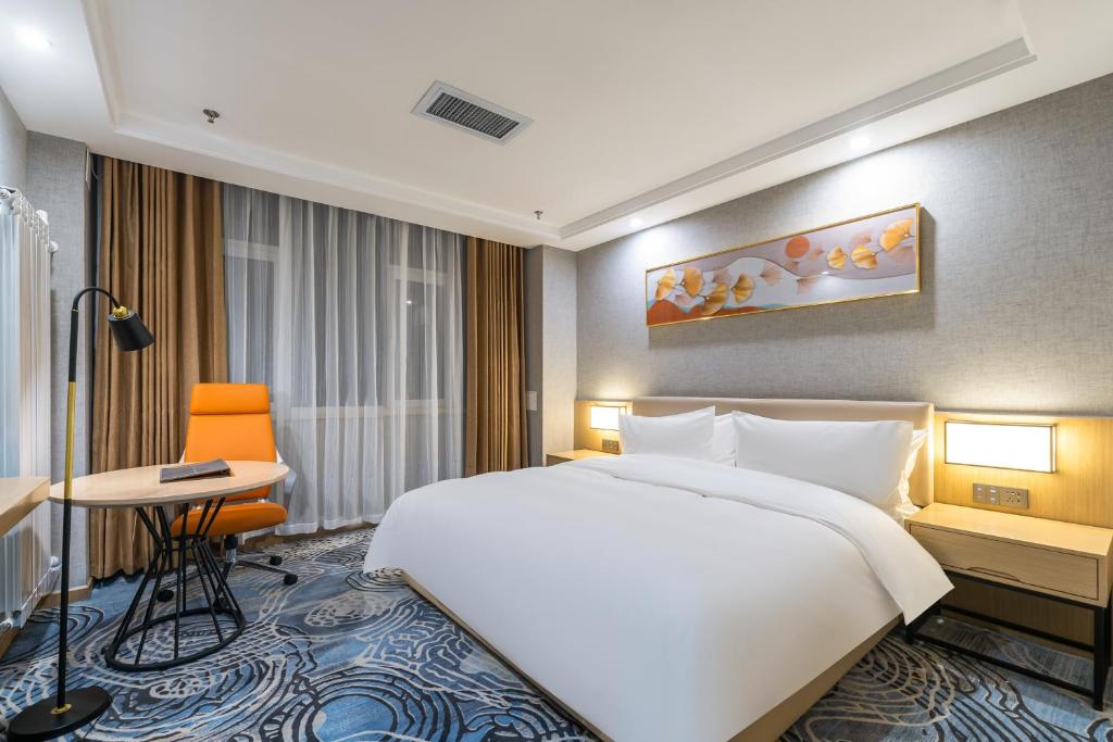 Postel nebo postele na pokoji v ubytování Joy Fall Hotel