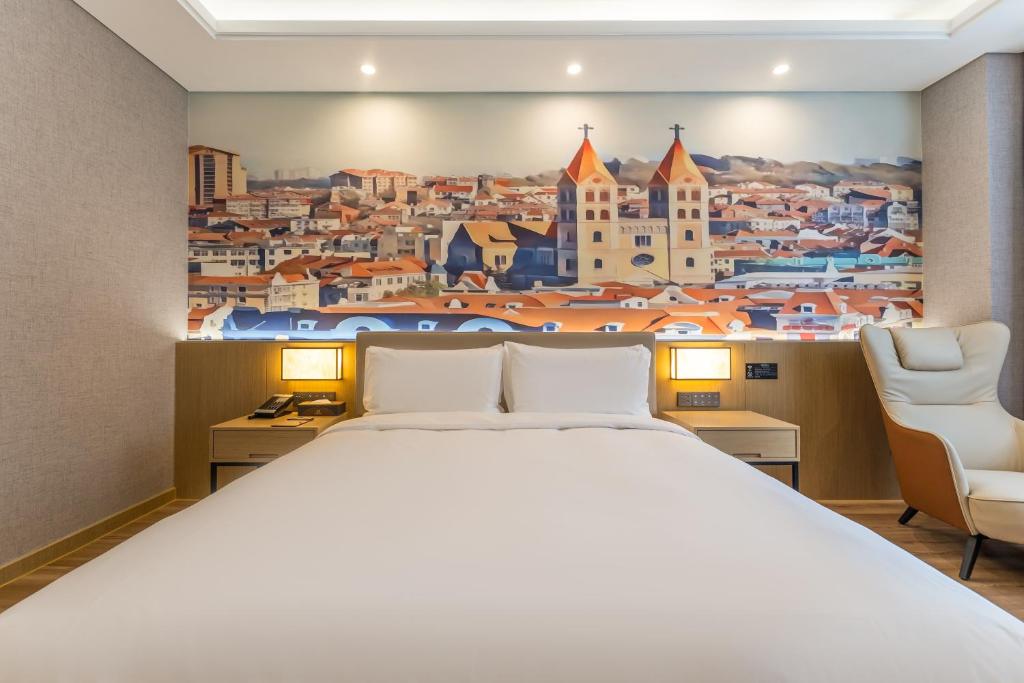 Postel nebo postele na pokoji v ubytování Joy Fall Hotel
