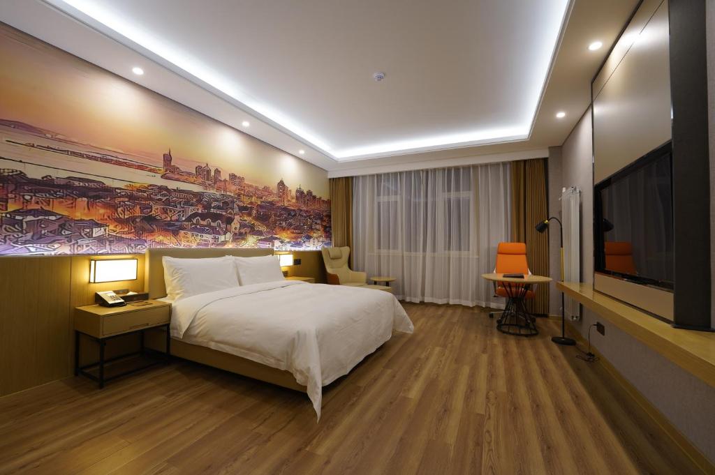 Postel nebo postele na pokoji v ubytování Joy Fall Hotel